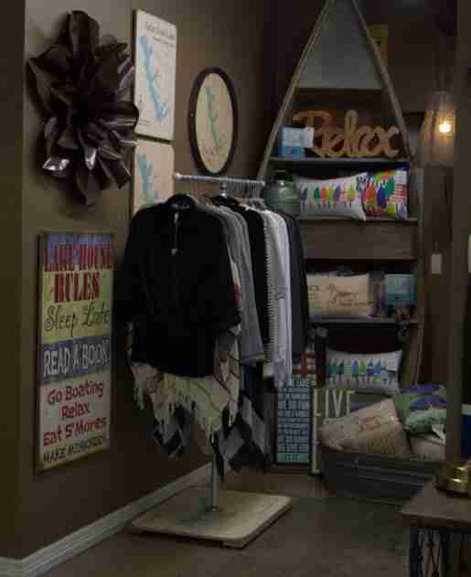 Apparel and signs share display space at Lakehouse Outfitters. After initial success with graphic tees, the store has added to its apparel selection.